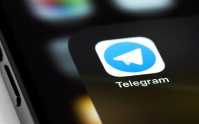 Image of phone with Telegram logo on it